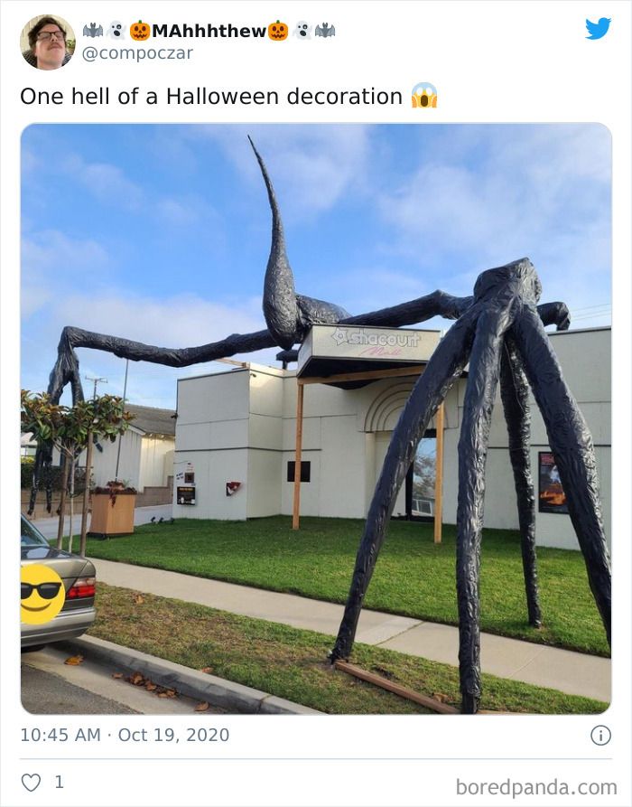 a large spider sculpture in front of a building