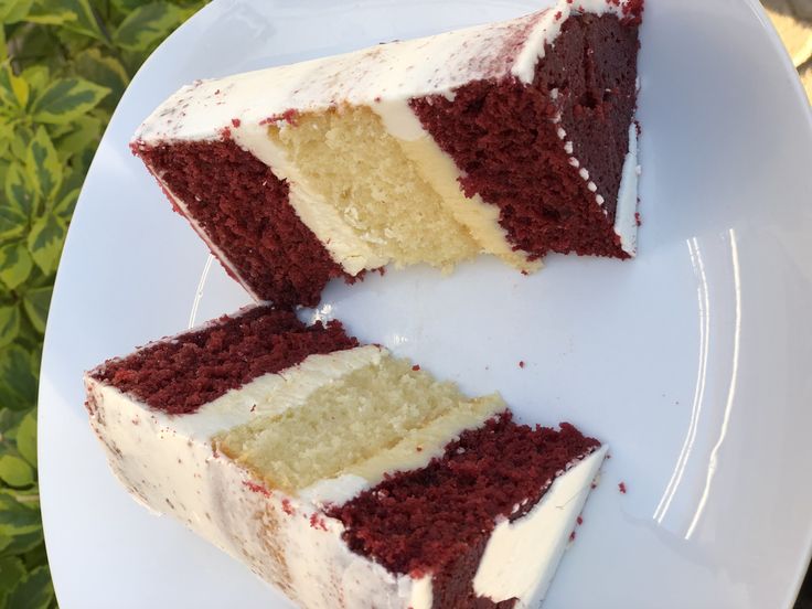 two slices of red velvet cake on a white plate