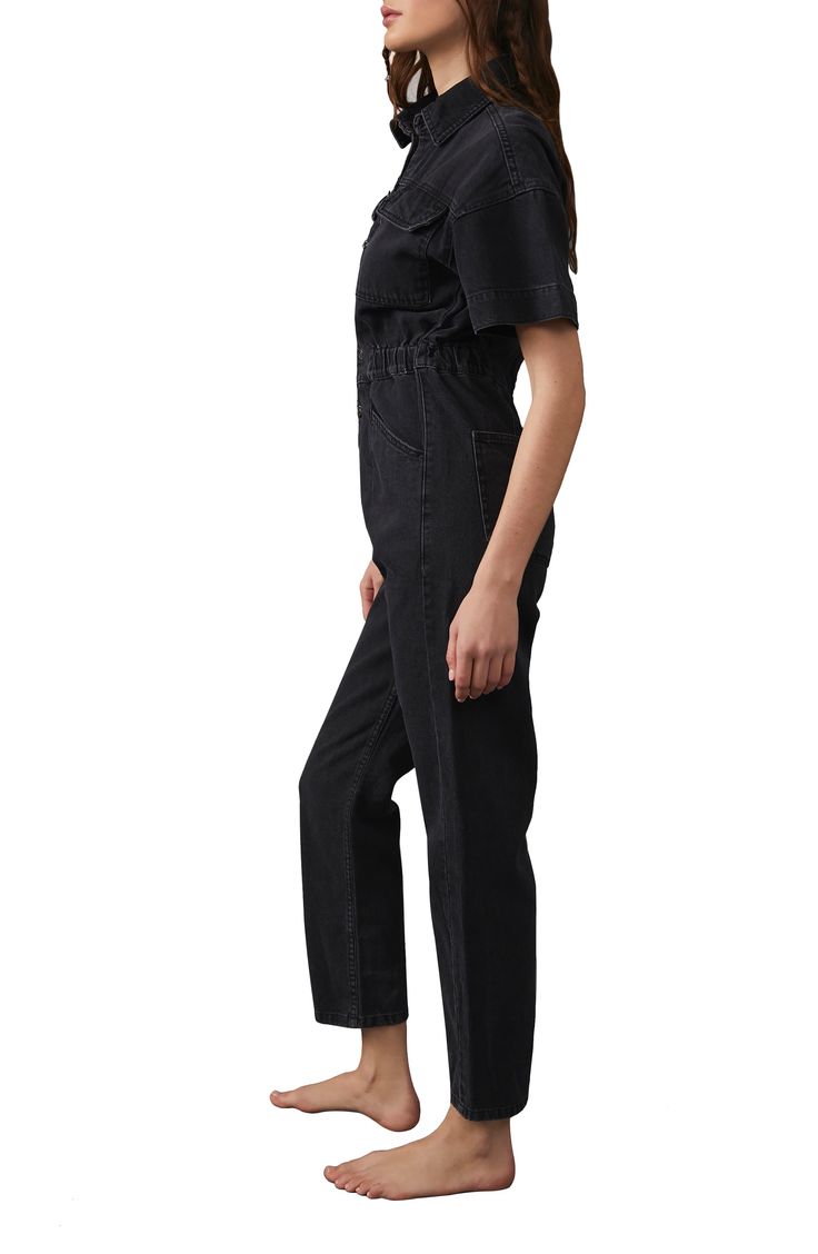 Rock an effortless casual-cool vibe in this denim jumpsuit designed in an inky wash with abbreviated sleeves. Spread collar Short sleeves 100% cotton Machine wash, tumble dry Imported Casual High Rise Relaxed Fit Jumpsuits And Rompers, Casual High Waist Overalls For Workwear, Casual High-waist Overalls For Workwear, Casual High Rise Denim Jumpsuit In Cotton, Black Utility Denim Jumpsuit For Fall, Casual High Rise Cotton Denim Jumpsuit, High Rise Cotton Jumpsuits And Rompers In Dark Wash, High Rise Dark Wash Cotton Jumpsuits And Rompers, High Rise Relaxed Fit Jumpsuits And Rompers For Fall