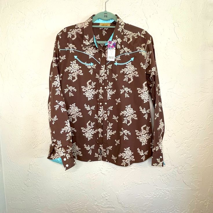 Wrangler 100% Cotton Western Shirt Size Xl. Chocolate With Cream Flowers And Turquoise Satin Trim. Pearl Snap Buttons. New With Tags. Western Brown Tops With Snap Buttons, Western Snap Button Tops, Cow Print Wrangler Shirt, Western Snap Button-up Tops, Western Style Snap Button-up Shirt, Vintage Wrangler, Western Wear For Women, Retro Women, Womens Long Sleeve Shirts