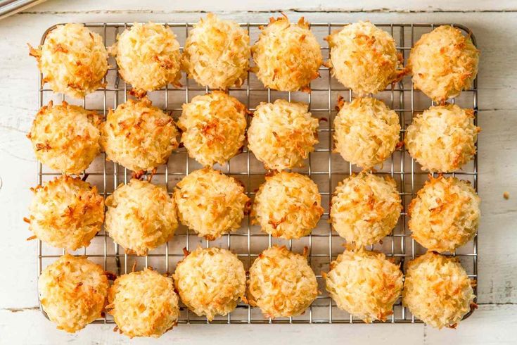 a cooling rack filled with coconut macaroni and cheese muffins