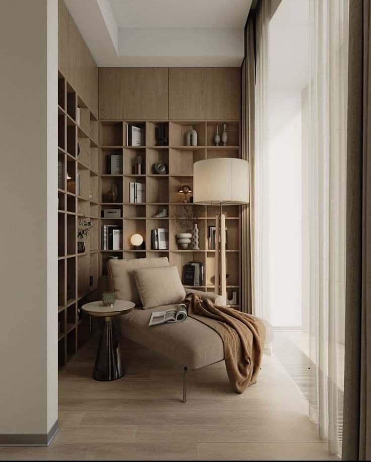 a living room filled with furniture and bookshelves next to a wall covered in shelves