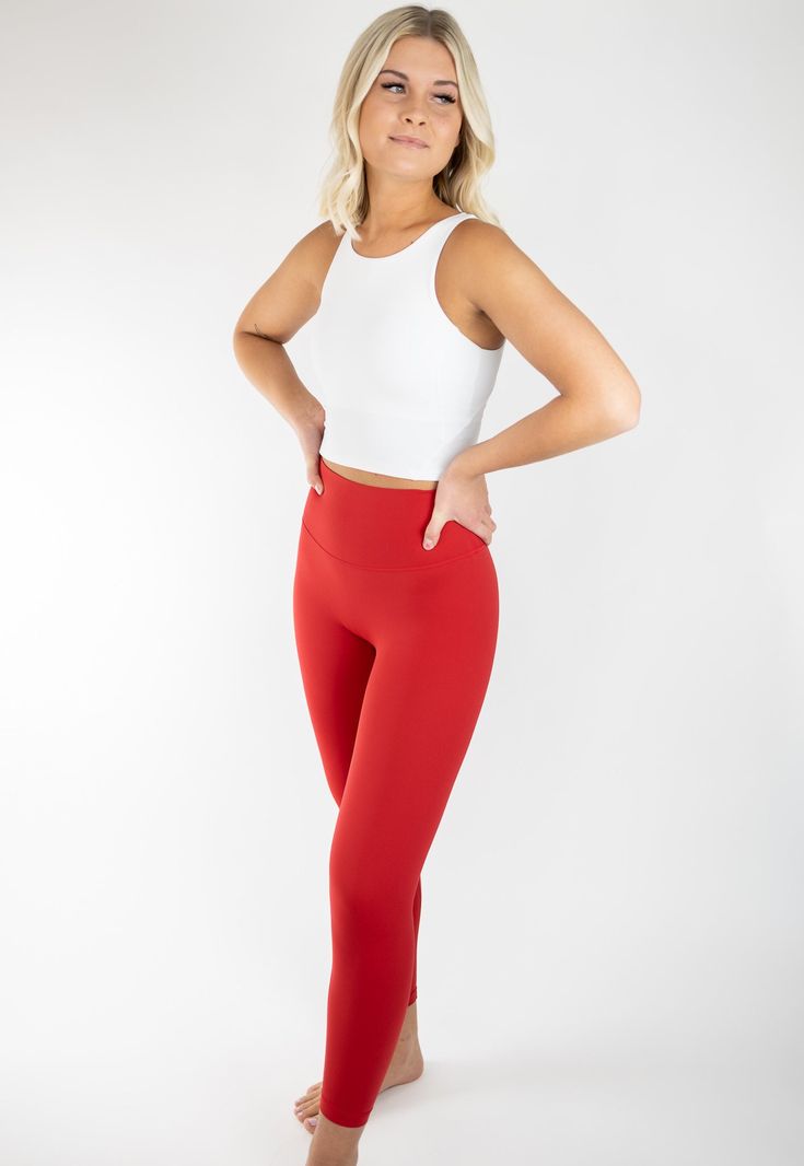 IDEAL FOR: Casual Wear, Dance, HITT, Lifting, Yoga + Pilates + Barre FEELS LIKE: Designed with a buttery soft fabric that offers the perfect amount of stretch and compression. Very Breathable. WHY WE LOVE THEM: Unbelievable flattering. Allow you to move freely while providing full support. EXTRAS: No front seam, which eliminates the camel toe look. Lint & Hair do not attract! Sizing Recommendations are as follows: 0/2-XS 4/6-S 8/10-M/L 12-XL Model Alexa in Bright Red Leggings is 6' and wearing a Seamless Elastane Leggings For Workout, Seamless Elastane Workout Leggings, Athleisure Compression Seamless Leggings, Seamless Elastane Leggings For Gym, Seamless 4-way Stretch Workout Leggings, Workout Leggings With Seamless 4-way Stretch, Red 4-way Stretch Yoga Leggings, Red 4-way Stretch Leggings For Yoga, Seamless Comfort Stretch Leggings For Yoga