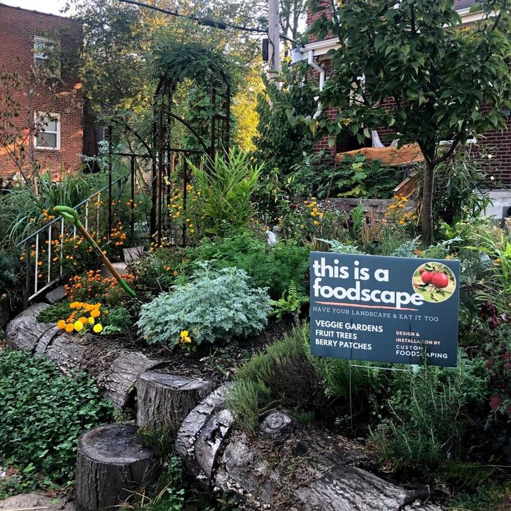 this is a foodscape sign surrounded by plants and trees