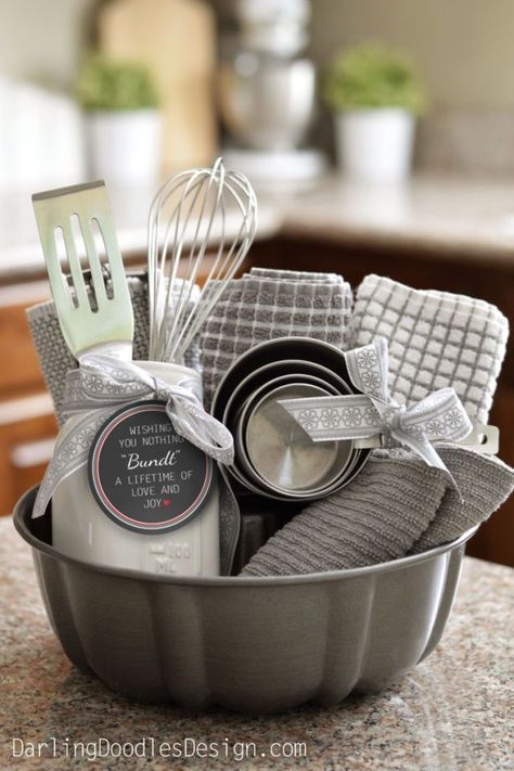 a metal pan filled with kitchen utensils on top of a counter