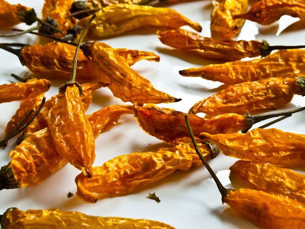 dried gourmet carrots on a white surface