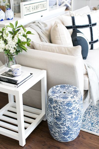 a living room with blue and white decor