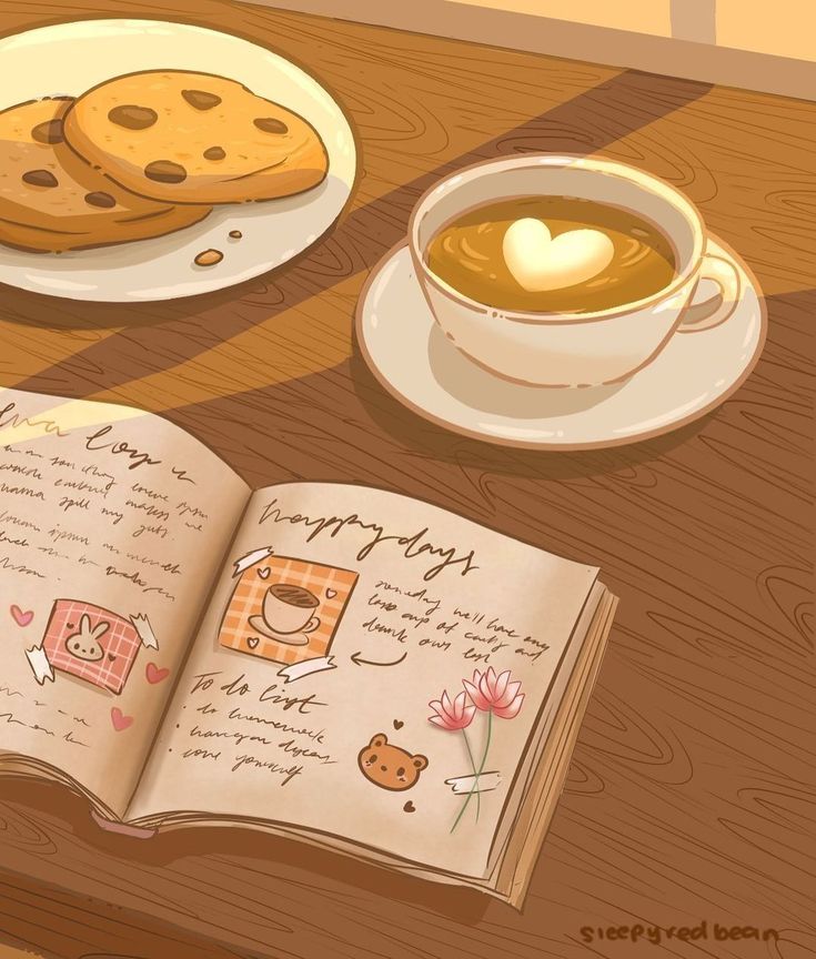 an open book sitting on top of a wooden table next to a cup of coffee