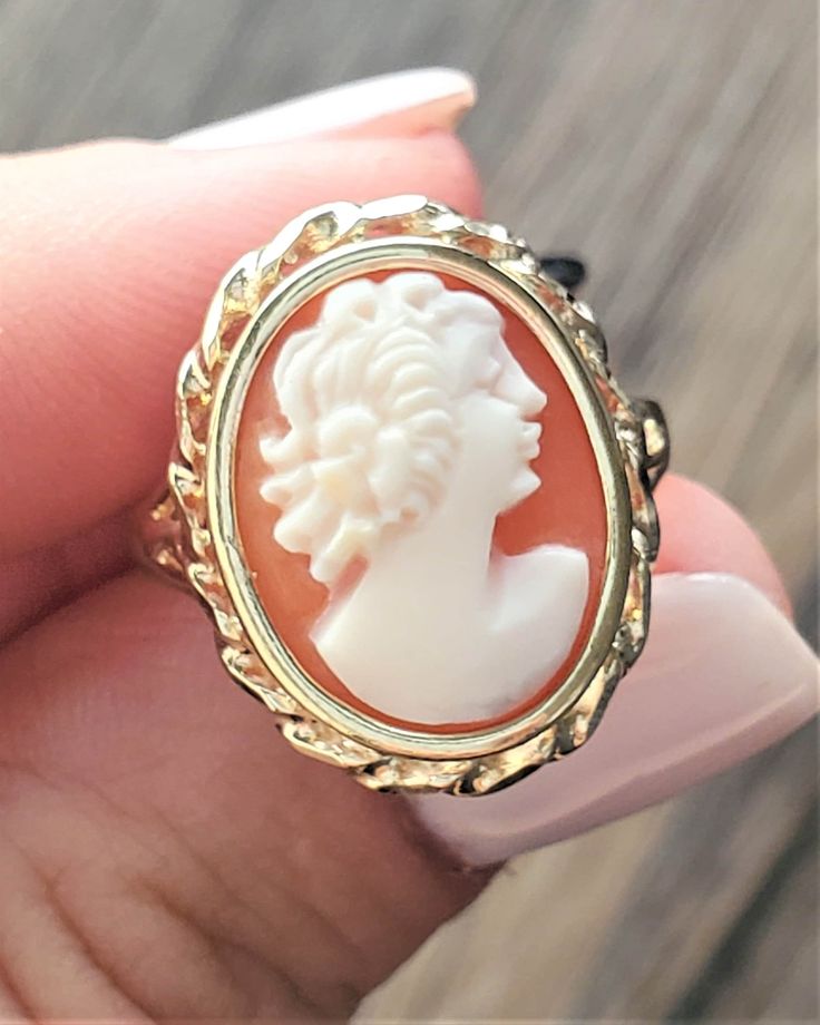 Vintage Cameo ring. Details: Size: US 6 ( Can be sized ) Weight: 3.2 grams Primary stone: Cameo Stone shape: Oval Band Width: Appx. 2mm Metal: 14k Yellow Gold Condition: Previously owned/great condition Inside of band is stamped and tested for '14k' gold. All pieces are polished and refinished in our shop. SIZING: Currently this ring is a size 6 but could be sized up or down for an additional small fee if desired by adding custom ring sizing to your cart upon checkout. Most sizing can be done wi Luxury Vintage Cameo Ring, Yellow Gold Polished Opal Ring, Classic Polished Opal Ring, Elegant Carved Jewelry For Promise Ring, Elegant Carved White Gold Rings, 14k Gold Opal Ring Hallmarked, Yellow Gold Intaglio Jewelry, Carved Ring Fine Jewelry, Fine Jewelry Carved Ring