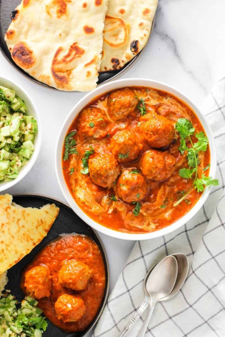 various dishes of food on a white table