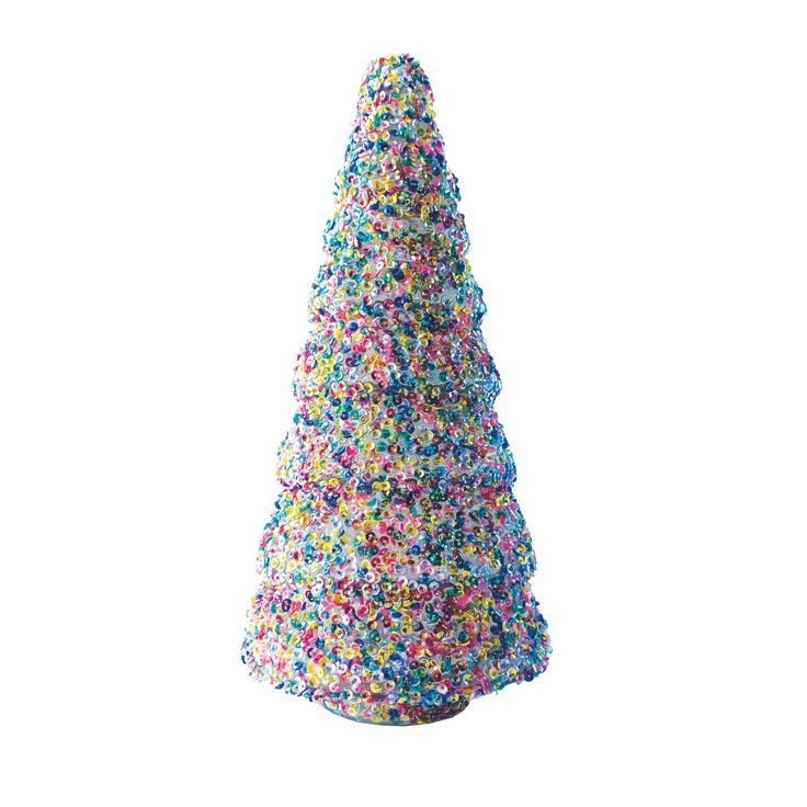 a sprinkle covered christmas tree on a white background