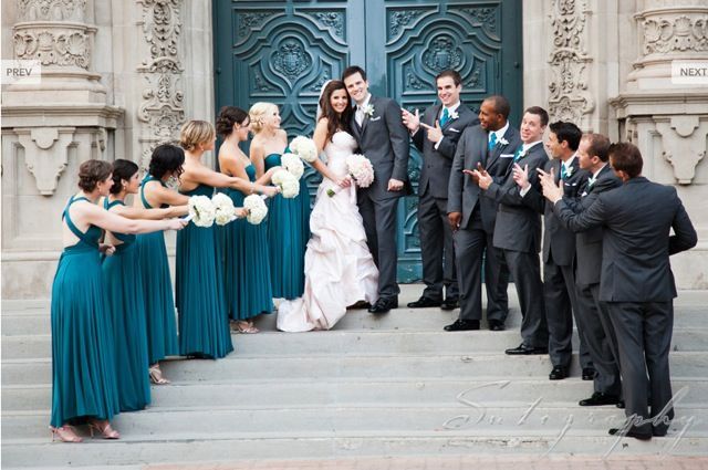 a group of people that are standing in front of a door with flowers on it