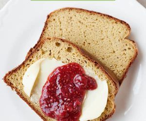 two slices of bread with jam and butter on them are sitting on a white plate