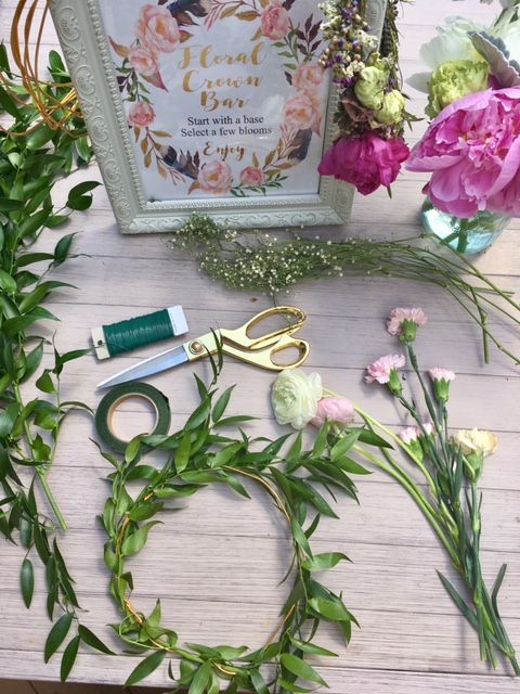 some flowers and scissors on a table