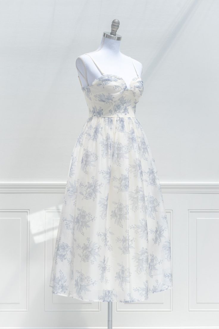 A charming dress for your next occasion, the Moonlit Waltz midi dress features a beautiful blue floral print organza, smocked elastic back, an a-line skirt with built-in tulle petticoat, removable shoulder straps, padded cups for extra support, and a sweetheart neckline. . Details: S: Bust 32"-34", Waist 24"-28", Length 43" M: Bust 34"-36", Waist 26"-30", Length 43.5" L: Bust 36"-38", Waist 28"-32", Length 44" Length Measured from Top of Bust Length from Waist to Hem: 33" Lined Material: 80% Pol Neckline Details, Tulle Petticoat, French Girl Style, Strapless Floral Dress, Blue Floral Print, French Girl, Waltz, Petticoat, Skirt Top