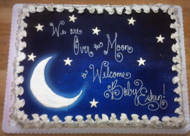 there is a cake that has been decorated with stars and the moon