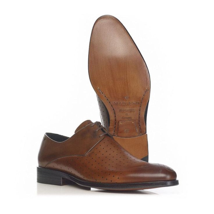 A sophisticated 3-hole derby with a unique perforated upper featuring the Mariano logo engraving.  Fine calf leather Handmade leather sole Option: Anti Slip Sole Material: Leather  Care intructions: Take good care of your shoes and they should do you proud for many years. Shoes should be put on using a shoe horn. Avoid wearing the same shoes on consecutive days since the moisture absorbed by the leather takes at least 24 hours to dry out. For storage, insert a shoe tree to avoid deformation of t Business Lace-up Shoes With Round Toe And Perforations, Brown Leather Lace-up Shoes With Perforations, Formal Dress Shoes With Perforated Toe, Business Oxfords With Perforated Plain Toe, Business Oxfords With Perforated Toe Box, Cognac Dress Shoes With Brogue Detailing For Business Casual, Leather Oxfords With Perforated Toe Box For Semi-formal Occasions, Formal Wingtip Oxfords With Perforations, Semi-formal Brown Oxfords With Perforated Toe Box