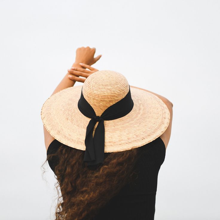 This Unique Beach Palm leaf hat is handmade by our artisan Magdaleno in Acapulco México. Details: Material: Palm Leaf Wide Brim fabric black bow Size M (56-58) all items are shipped from the USA. All Mi Mundo Mexicano items are 100% handmade by artisans in Mexico. Each stitch and item is completely unique and one-of-a-kind, so you'll never find two that are exactly the same! All handmade items may vary slightly in size, color, and design - that's what makes handmade items so special and charming Handwoven Hats For Vacation And Kentucky Derby, Handwoven Hats For Kentucky Derby Vacation, Handmade Sun Hat For Kentucky Derby Vacation, Black Toquilla Straw Panama Hat For Beach, Black Woven Beach Hat, Black Woven Panama Hat For Beach, Black Toquilla Straw Panama Hat For The Beach, Bohemian Black Panama Hat For Beach, Black Woven Panama Hat For The Beach