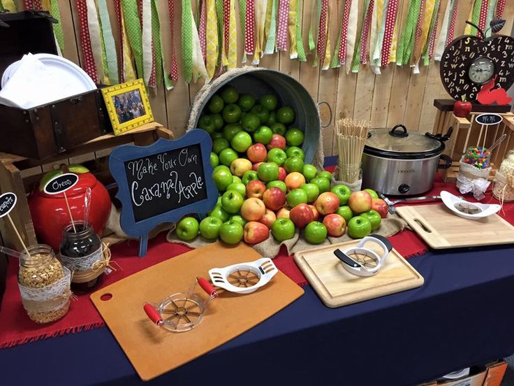 there is a table with apples and other items on it that are ready to be served