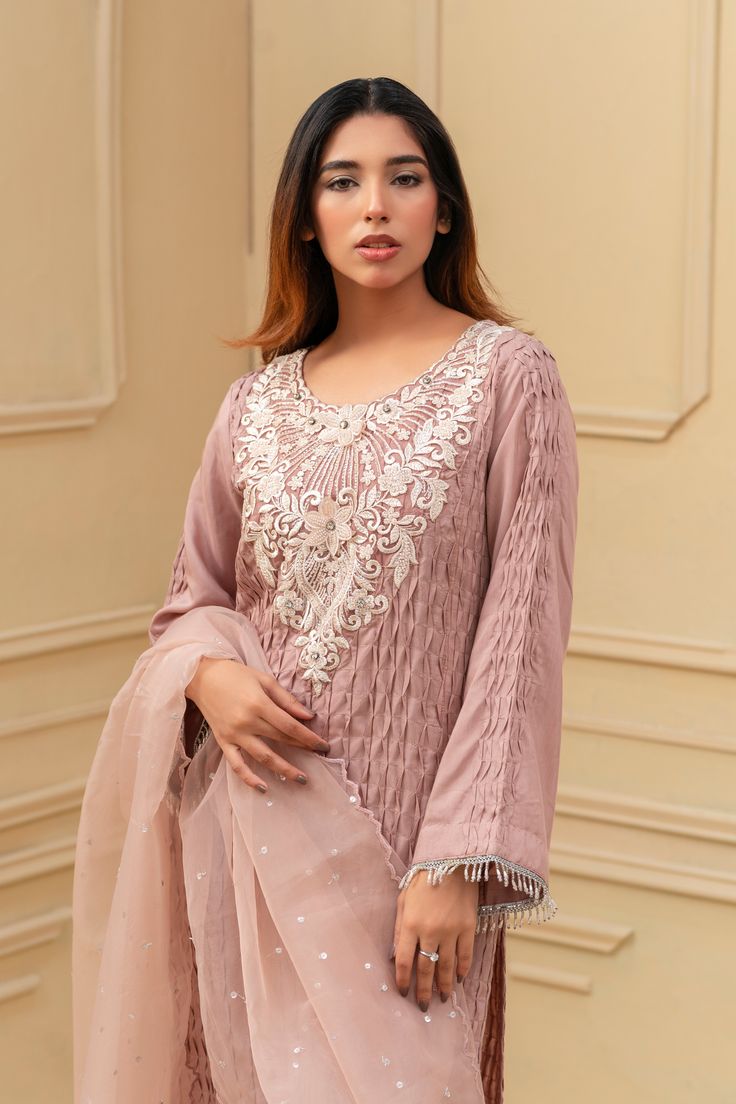 This stunning Shalwar Kameez features a luxurious silk and pearl detailed material, adorned with hand-embroidered off-white neckline. The intricate pattern and rich colors make it a perfect choice for any special occasion. Complete the look with the included organza dupatta with full chhan for a sophisticated and elegant ensemble. 3-Piece Suit Festive Raw Silk Sharara With Pearl Embroidery, Semi-stitched Anarkali Sharara With Pearl Embroidery, Elegant Georgette Churidar With Intricate Embroidery, Anarkali-style Semi-stitched Sharara With Pearl Embroidery, Festive Silk Sharara With Pearl Embroidery, Bollywood Style Sharara With Pearl Embroidery For Eid, Festive Tissue Silk Dresses With Pearl Embroidery, Anarkali Style Sharara With Pearl Embroidery In Georgette, Festive Unstitched Sharara With Pearl Embroidery