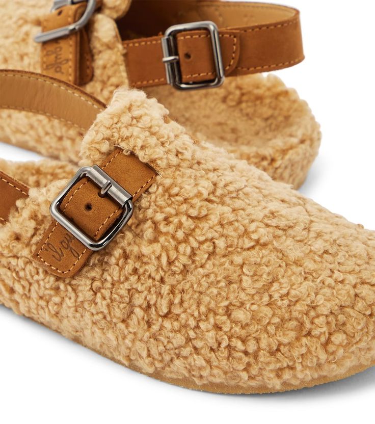 Faux shearling slippers in beige - Il Gufo | Mytheresa Comfortable Slip-on Slippers With Buckle Closure, Shearling Slip-on Slippers With Textured Footbed, Shearling Slippers With Textured Footbed And Round Toe, Brown Slip-on Slippers With Buckle Closure, Brown Closed Toe Slippers With Buckle Closure, Shearling Slippers, Slippers