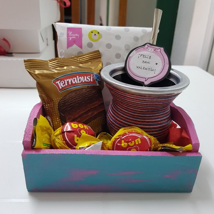 a box filled with candy and candies on top of a table