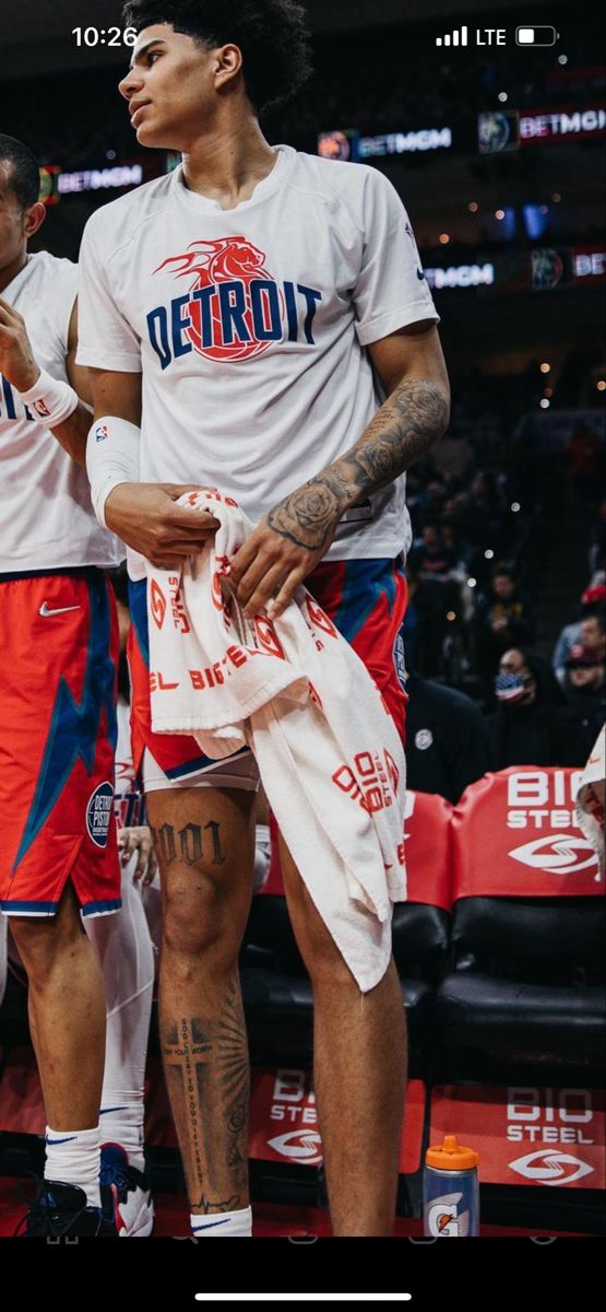 two basketball players standing next to each other