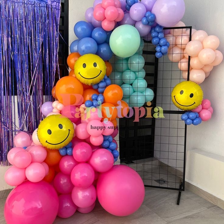 balloons are arranged in the shape of smiley faces