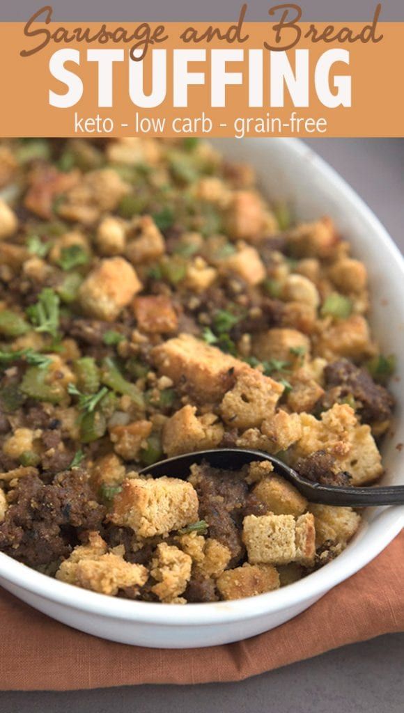 sausage and bread stuffing in a white bowl with a spoon