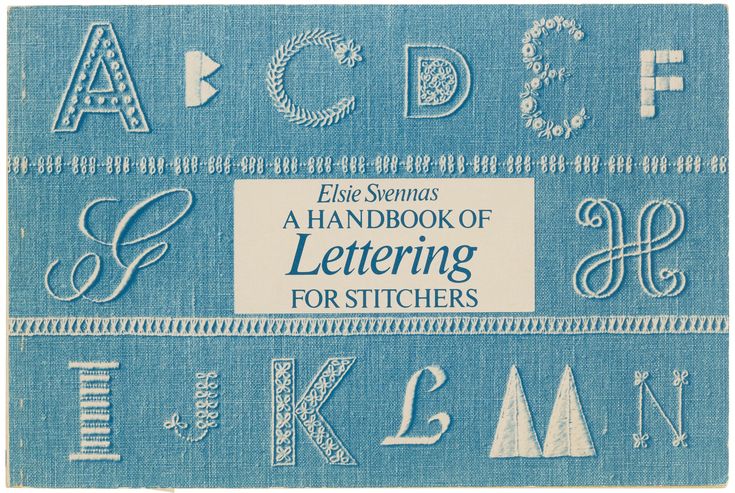 the front cover of an old book with letters and numbers in blue linen on it