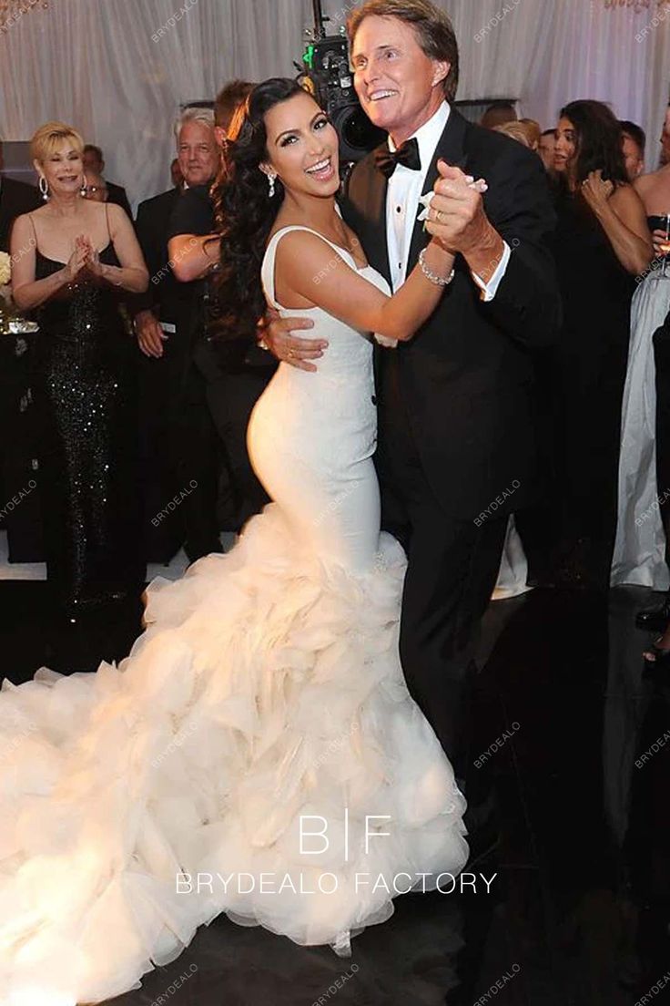 a man and woman dancing together at a formal event