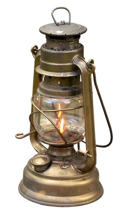 an old fashioned lantern with a lit candle inside