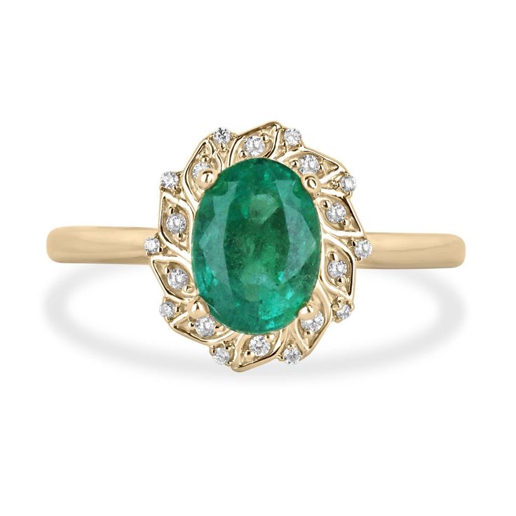 an oval emerald and diamond ring in yellow gold