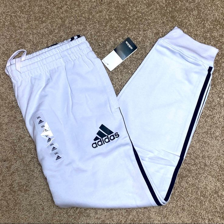 Nwt Msrp $50 Adidas Cotton Blend Quality 1 Color White And Black 3 - Stripes Quality 80% Cotton Side Pockets Size Xxl (18 Inches) Elastic Waist Free Shipping 2-4 Day Delivery White Adidas Activewear For Streetwear, White Bottoms With Three Stripes For Gym, Adidas White Activewear With Three Stripes, White Sweatpants With Three Stripes For Sports, Adidas White Sporty Sweatpants, White Adidas Sportswear Bottoms, Adidas White Sportswear Bottoms, White Sportswear Bottoms With Three Stripes, White Stretch Activewear With Three Stripes