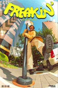 a magazine cover with an image of a woman on top of a pole and a car in the background