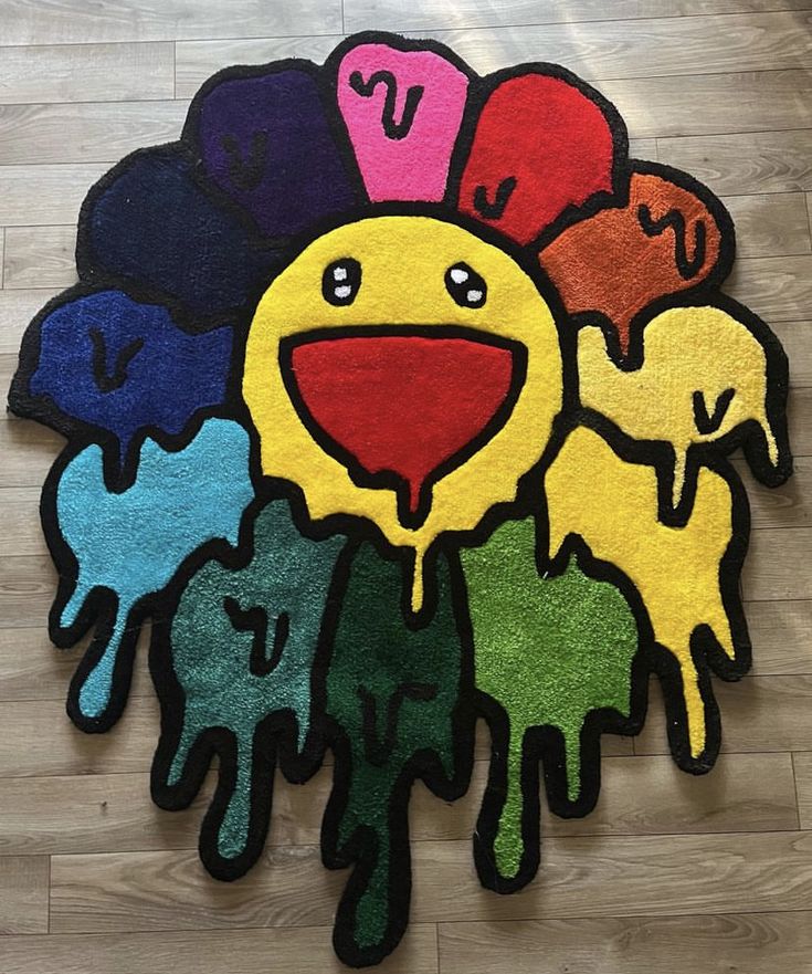 a colorful rug with different colored hands on it