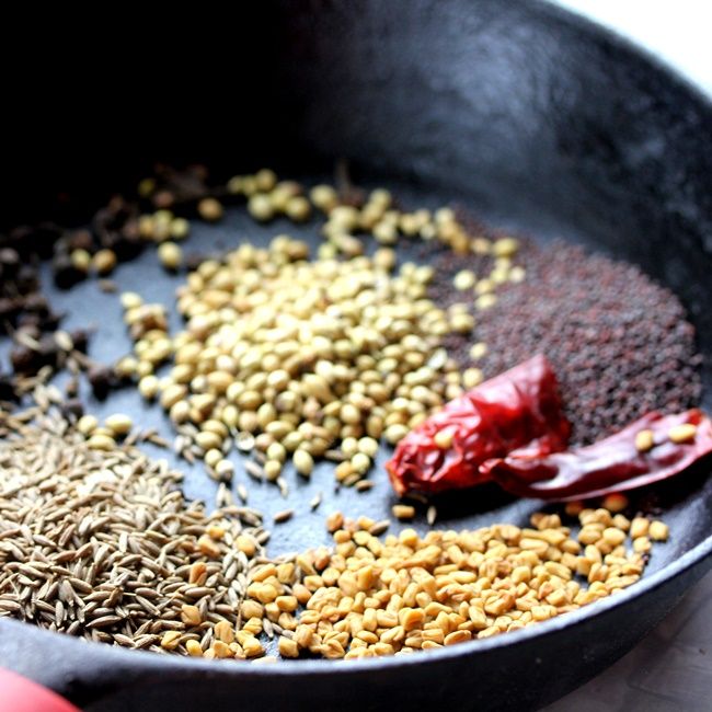 an assortment of spices in a frying pan