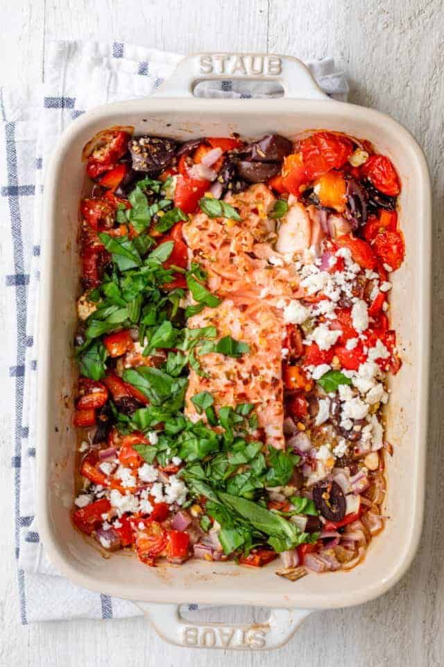 a casserole dish filled with meat and vegetables