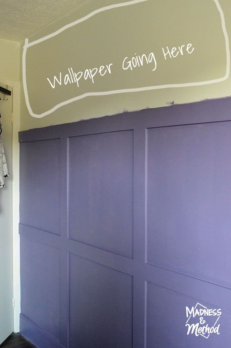 a purple painted garage door with the words wallpaper going here on it