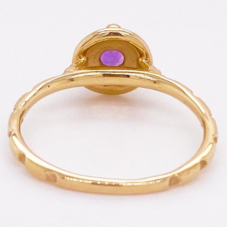 This stunning amethyst set in yellow gold is is sure to take your breath away! This ring provides a look that is very modern yet classic. This ring is very fashionable and can add a touch of style to any outfit, yet it is also classy enough to pair easily with formal wear. It looks beautiful by itself but also looks wonderful in a stack or as a wedding band! This ring would make the perfect gift for yourself or your loved one!14K Yellow GoldGemstone: AmethystGemstone Weight: .22 CaratsGemstone S Elegant Yellow Gold Amethyst Open Ring, Fine Jewelry Gold Amethyst Ring, Fine Jewelry Gold Ring With Amethyst, Fine Jewelry Amethyst Gold Ring, Luxury Gold Amethyst Ring With Bezel Setting, Luxury Yellow Gold Amethyst Ring With Bezel Setting, Yellow Gold Rings With Halo And Round Stone, Yellow Gold Ruby Ring With Round Stone, Gold Amethyst Open Ring Fine Jewelry