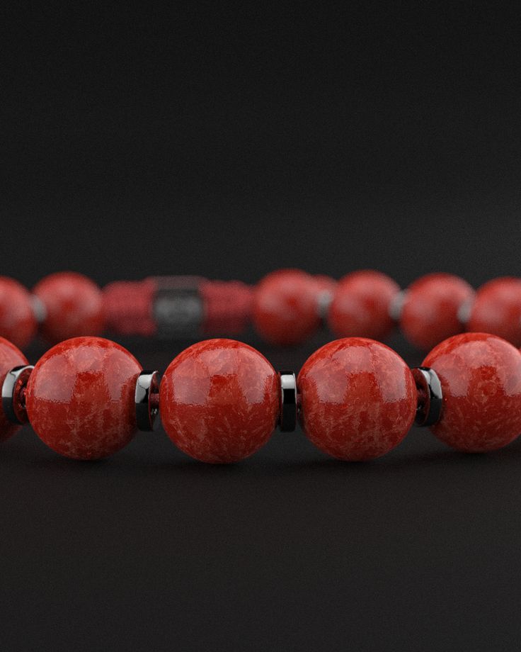 Experience the powerful energy and bold elegance of the Red Coral Jade Bracelet from the Prayer Collection. This stunning piece combines the vibrant red hues of coral jade with a sophisticated design, making it a standout accessory for any occasion. Design and Materials: Red Coral Jade Beads: Featuring smooth 8mm red coral jade beads, this bracelet embodies the striking red tones known for their energizing and protective properties. Gold Plated Cylindrical Spacers: Each jade bead is separated by Red Jade Bracelet, Accessory Design, Red Jade, Stacked Necklaces, Red Tigers Eye, The Prayer, Jade Bracelet, Recycled Silver, Black Rhodium