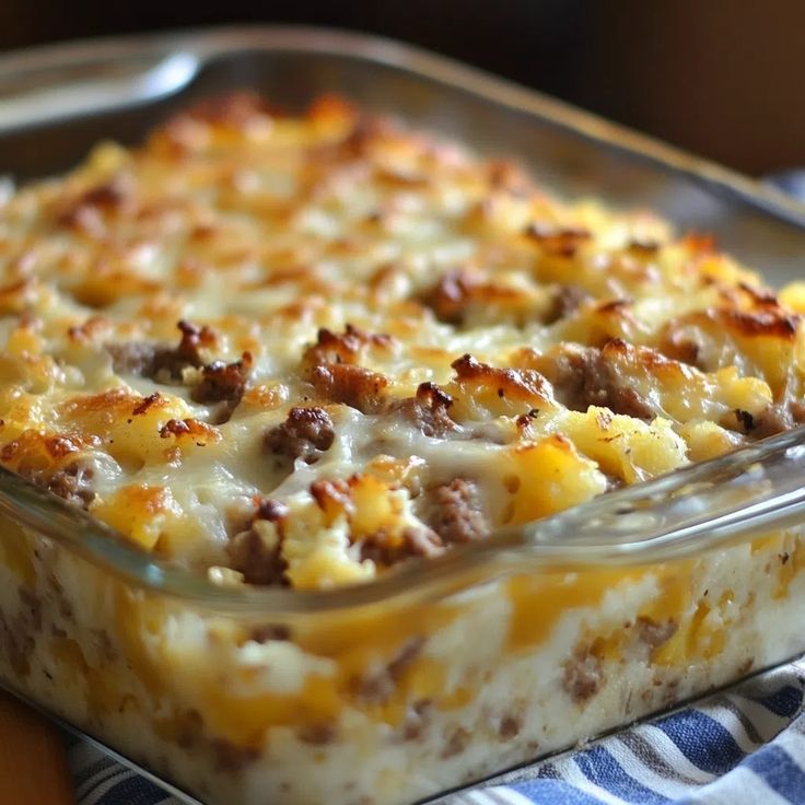 a casserole dish with meat and cheese in it