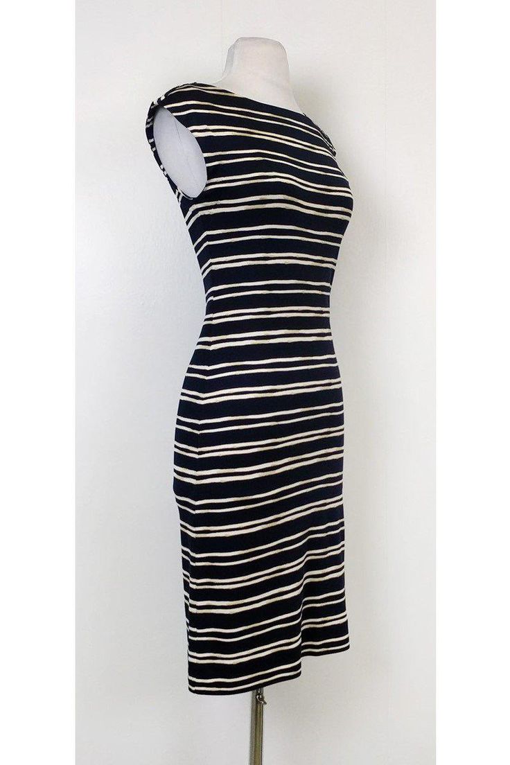 Make a statement in bold stripes! This nautical inspired dress is lightweight and stylish. Pair it with a red lip and chic wedges for a day time ready ensemble. Size XS 100% silk Boat neck Slips on Striped pattern Sleeveless Fitted Bust 32" Waist 28" Shoulder to hem 38" Fitted Sleeveless Midi Dress With Vertical Stripes, Chic Dresses With Horizontal Stripes, Fitted Striped Midi Dress For Beach, Chic Vertical Stripes Midi Dress For Beach, Chic Beach Midi Dress With Vertical Stripes, Chic Midi Dress With Vertical Stripes For Beach, Chic Sleeveless Dress With Striped Hem, Summer Midi Dress With Vertical Stripes, Chic Striped Lined Midi Dress