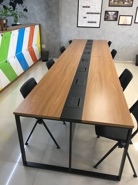 a long table with chairs around it in a room