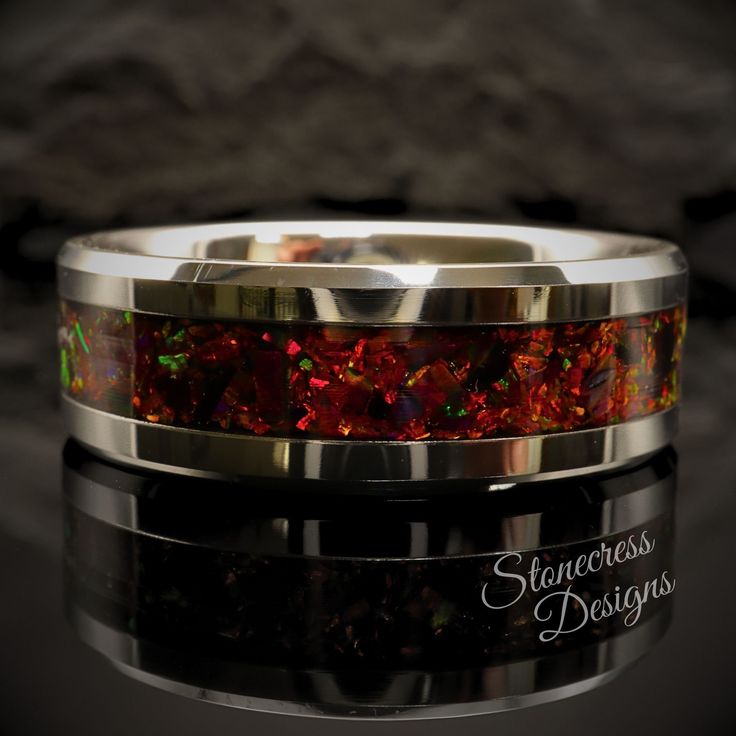 a wedding band with red and green glitter inlayed to the inside of it