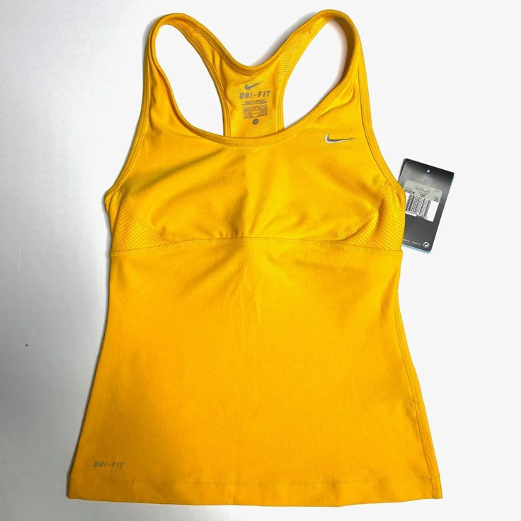 Nike Dri-Fit Training Top. Sleeveless. Perfect For High Impact Sports. Ventilated. Stay Cool Technology. Size: Xs Condition: New With Tags Measurements: Length 21” | Armpit To Armpit 12 ¾” | Shoulder To Shoulder 9” | *Measurements Are Approximate & Taken With Item Laying Flat* Fitted Racerback Tops For Sports, Medium Support Workout Camisole Top, Fitted Sleeveless Sports Tank Top, Medium Support Camisole Tops For Workout, Nike Sleeveless Sports Vest, Fitted Sports Tank Top With Tank Straps, Fitted Racerback Tank Top For Sports, Fitted Tank Tops For Sports, Sporty Fitted Camisole Tops