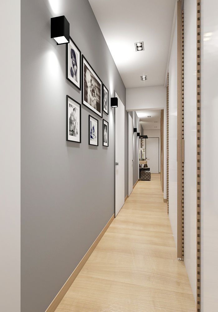 a long hallway with pictures on the wall