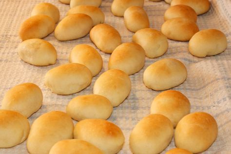 bread rolls laid out on a table ready to be baked