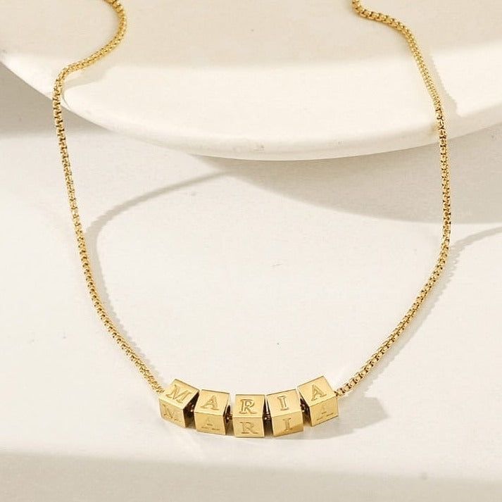 Durable and stylish, our waterproof necklace is crafted for both functionality and fashion. Perfect for any occasion, it's the ideal accessory for those who appreciate durability and timeless elegance. Perfect for the minimalist and a beautiful piece to layer with. A true versatile statement piece that you can wear straight from the pool to dinner! - 18K gold plated / stainless steel - Waterproof technology - 18" in length - Necklace + 1 cube (initial or sign) = $45 - Additional cubes with lette Minimalist Personalized Square Pendant Necklace, Trendy Personalized Necklaces For Everyday, Minimalist Box Chain Choker, Everyday Personalized Square Pendant Necklaces, Everyday Jewelry Choker With Box Chain, Everyday Jewelry Box Chain Choker, Everyday Adjustable Gold Name Necklace, Adjustable Elegant Everyday Name Necklace, Elegant Adjustable Name Necklace For Everyday