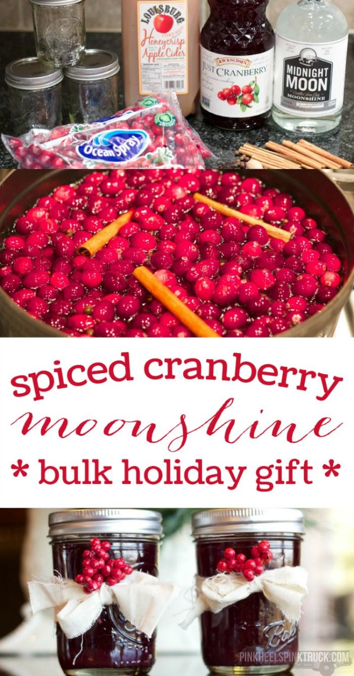 two jars filled with cranberry jam and cinnamon sticks on top of a table